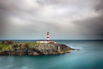 After some heavy rain showers the Sun broke through the clouds and lit up the lighthouse and surrounding landscape, revealing also, the beautiful turquoise water which can be seen so clearly in all weather on the Western isles.<br /><a href="https://shop.photo4me.com/picture.aspx?id=690561&f=canvas"><font>Buy Print or Canvas</font></a><a></a> <a href="https://shop.photo4me.com/picture.aspx?id=690561&f=canvas"></a><a></a>