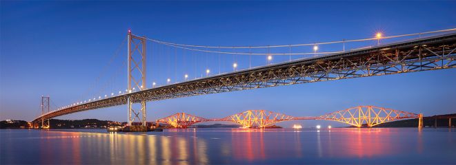 The Forth Road bridge and Forth railway bridge lit up at evening twilight.<br /><a href="https://shop.photo4me.com/picture.aspx?id=690536&f=canvas"><font>Buy Print or Canvas</font></a><a></a> <a href="https://shop.photo4me.com/picture.aspx?id=690536&f=canvas"><img src="https://www.photoscotland.net/captionpic/p4me.jpg" alt="p4me.jpg" /></a><a></a>