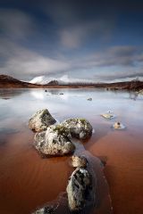 A partially frozen Lochan na h-Achlaise and the Black Mount mountain range, Rannoch Moor near Glencoe.<br /><a href="https://shop.photo4me.com/picture.aspx?id=259868&f=canvas"><font>Buy Print or Canvas</font></a><a></a> <a href="https://shop.photo4me.com/picture.aspx?id=259868&f=canvas"><img src="https://www.photoscotland.net/captionpic/p4me.jpg" alt="p4me.jpg" /></a><a></a>