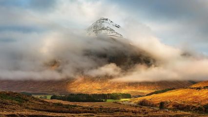 This is a photograph I took of a scottish mountain called Beinn Dorain, which was shrouded in mist with the snowy peak peeking through, on a cold winter Christmas day 2014.