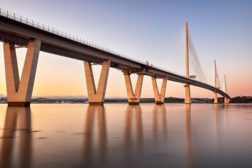 Reflections of the new Queensferry Crossing bridge over the Firth of Forth during Sunset.<br /><a href="https://shop.photo4me.com/picture.aspx?id=690479&f=canvas"><font>Buy Print or Canvas</font></a><a></a> <a href="https://shop.photo4me.com/picture.aspx?id=690479&f=canvas"></a><a></a>