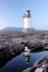 Rhue lighthouse reflecting on a rock pool. Taken near Ullapool in the north west Scottish highlands.<br /><a href="https://shop.photo4me.com/picture.aspx?id=464703&f=canvas"><font color="#f59042">Buy Print or Canvas</font></a><a></a> <a href="https://shop.photo4me.com/picture.aspx?id=464703&f=canvas"><img src="https://www.photoscotland.net/captionpic/p4me.jpg" alt="p4me.jpg" /></a><a></a>