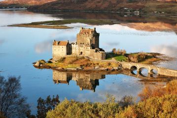 Eilean Donan Castle reflecting on Loch Duich on a sunny Autumn day.<br /><a href="https://shop.photo4me.com/picture.aspx?id=625562&f=canvas"><font>Buy Print or Canvas</font></a><a></a> <a href="https://shop.photo4me.com/picture.aspx?id=625562&f=canvas"><img src="https://www.photoscotland.net/captionpic/p4me.jpg" alt="p4me.jpg" /></a><a></a>
