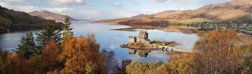 A panoramic image of Eilean Donan Castle reflecting on Loch Duich and surrounded with the colours of Autumn.<br /><a href="https://shop.photo4me.com/picture.aspx?id=625674&f=canvas"><font>Buy Print or Canvas</font></a><a></a> <a href="https://shop.photo4me.com/picture.aspx?id=625674&f=canvas"><img src="https://www.photoscotland.net/captionpic/p4me.jpg" alt="p4me.jpg" /></a><a></a>