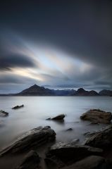 A long exposure from the rocky shore of Elgol on the Isle of Skye, with the Cuillin mountains in the distance.<br /><a href="https://shop.photo4me.com/picture.aspx?id=573331&f=canvas"><font>Buy Print or Canvas</font></a><a></a> <a href="https://shop.photo4me.com/picture.aspx?id=573331&f=canvas"><img src="https://www.photoscotland.net/captionpic/p4me.jpg" alt="p4me.jpg" /></a><a></a>