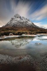 A one minute long exposure of the snow topped Buachaille etive mor mountain and the partially frozen River Coupall.<br /><a href="https://shop.photo4me.com/555161/canvas"><font>Buy Print or Canvas</font></a><a></a> <a href="https://shop.photo4me.com/555161/canvas"><img src="https://www.photoscotland.net/captionpic/p4me.jpg" alt="p4me.jpg" /></a><a></a>