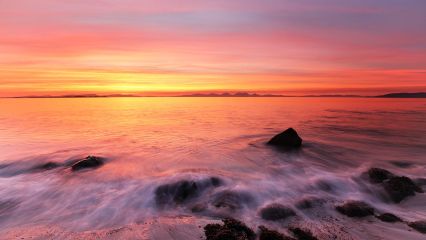 A beautiful and mesmerising Sunset from the rocky west coast of Kintyre with the island of Jura in the distance.<br /><a href="https://shop.photo4me.com/picture.aspx?id=658523&f=canvas"><font>Buy Print or Canvas</font></a><a></a> <a href="https://shop.photo4me.com/picture.aspx?id=658523&f=canvas"><img src="https://www.photoscotland.net/captionpic/p4me.jpg" alt="p4me.jpg" /></a><a></a>