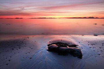 A beautiful and mesmerising Sunset from the rocky west coast of Kintyre with the island of Jura in the distance.<br /><a href="https://shop.photo4me.com/picture.aspx?id=659008&f=canvas"><font>Buy Print or Canvas</font></a><a></a> <a href="https://shop.photo4me.com/picture.aspx?id=659008&f=canvas"><img src="https://www.photoscotland.net/captionpic/p4me.jpg" alt="p4me.jpg" /></a><a></a>