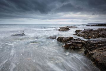 A long exposure from the rocky shore of Clachan on the west coast of Kintyre, Scotland.<br /><a href="https://shop.photo4me.com/picture.aspx?id=482670&f=canvas"><font>Buy Print or Canvas</font></a><a></a>   <a href="https://shop.photo4me.com/picture.aspx?id=482670&f=canvas"><img src="https://www.photoscotland.net/captionpic/p4me.jpg" alt="p4me.jpg" /></a><a></a>