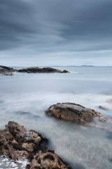 A long exposure from the rocky shore of Clachan on the west coast of Kintyre, Scotland.<br /><a href="https://shop.photo4me.com/picture.aspx?id=482642&f=canvas"><font color="#f59042">Buy Print or Canvas</font></a><a></a>   <a href="https://shop.photo4me.com/picture.aspx?id=482642&f=canvas"><img src="https://www.photoscotland.net/captionpic/p4me.jpg" alt="p4me.jpg" /></a><a></a>