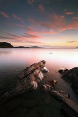 A long exposure of a beautiful sunset from the rocky shore of Easdale, Seil island.<br /><a href="https://shop.photo4me.com/picture.aspx?id=325103&f=canvas"><font color="#f59042">Buy Print or Canvas</font></a><a></a>   <a href="https://shop.photo4me.com/picture.aspx?id=325103&f=canvas"><img src="https://www.photoscotland.net/captionpic/p4me.jpg" alt="p4me.jpg" /></a><a></a>