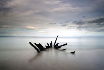 The skelton of an old shipwreck on a Scottish east coast beach.<br /><a href="https://shop.photo4me.com/picture.aspx?id=332403&f=canvas"><font>Buy Print or Canvas</font></a><a></a> <a href="https://shop.photo4me.com/picture.aspx?id=332403&f=canvas"><img src="https://www.photoscotland.net/captionpic/p4me.jpg" alt="p4me.jpg" /></a><a></a>
