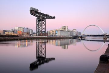 A beautiful Sunset from the River Clyde with Clyde Arc Bridge and Finnieston Crane reflecting on the calm water.<br /><a href="https://shop.photo4me.com/picture.aspx?id=564680&f=canvas"><font color="#f59042">Buy Print or Canvas</font></a><a></a> <a href="https://shop.photo4me.com/picture.aspx?id=564680&f=canvas"><img src="https://www.photoscotland.net/captionpic/p4me.jpg" alt="p4me.jpg" /></a><a></a>